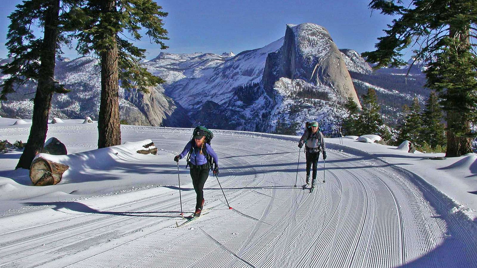 Cross-country skiers enjoying the 10.5 mile trek from Glacier Point