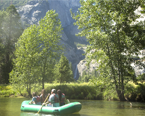 Family rafting down the Merced River in Yosemite National Park